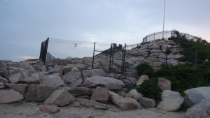 The sea wall and fence sitting at the end of the public beach, and at the bottom of the Swift residence. (photo credit: Ryan Jacobson) 